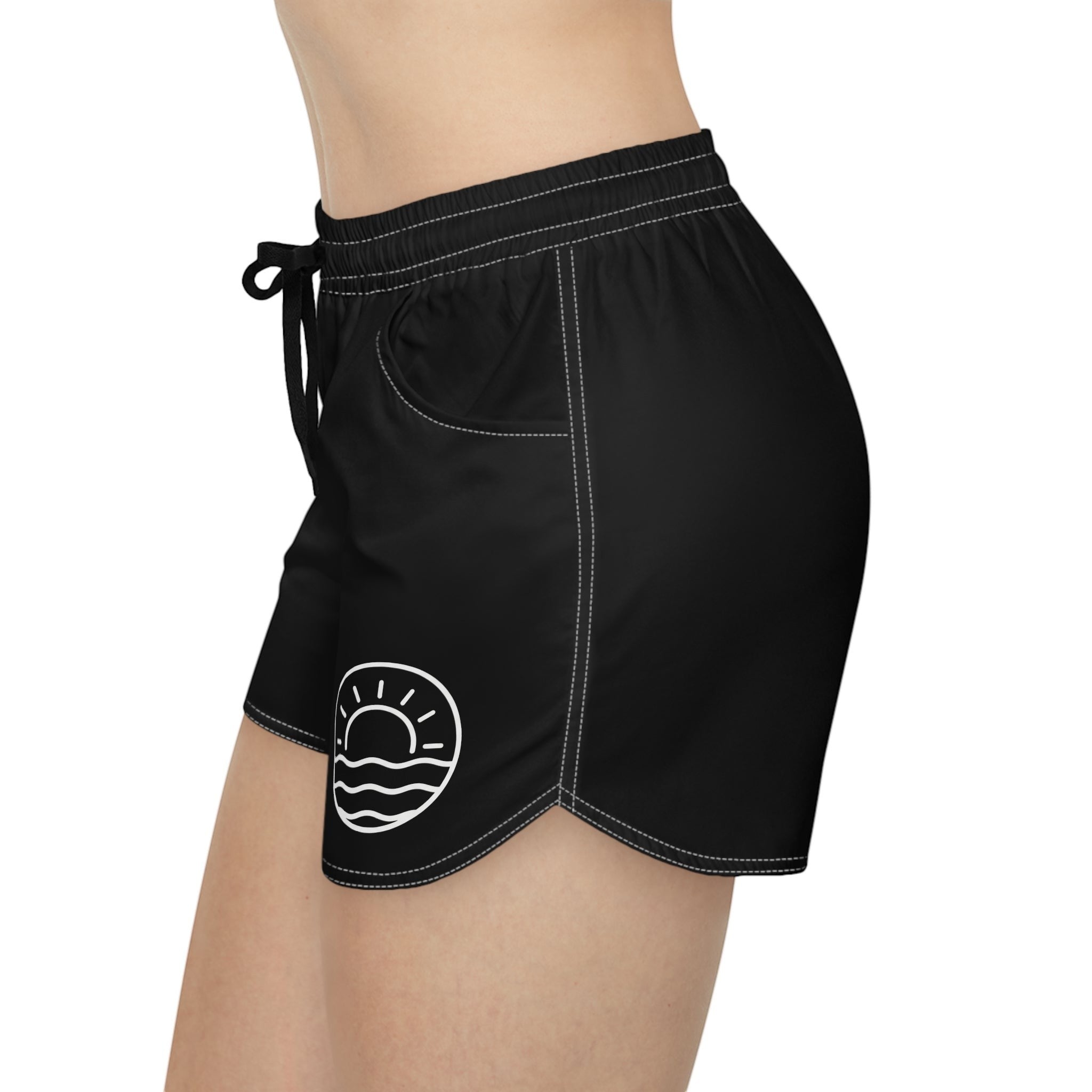 Aqua Sol Company black quick-dry coastal shorts with white contrast stitching, drawstring waist, and sunrise emblem.